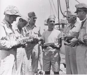 Captain Kossler  being interviewed by war correspondents at Saipan on 7/2/44.