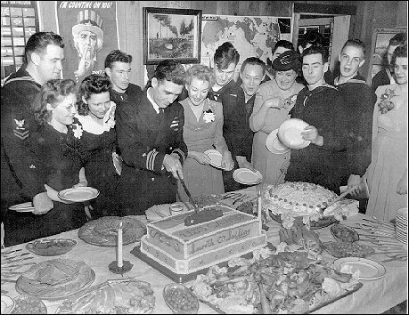 Capt. Kossler and his wife cutting the ship's cake